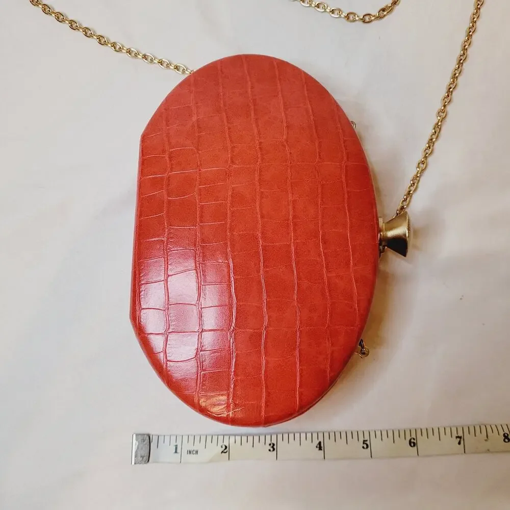 Sondra Roberts red croc embossed leather oval hard case cross body bag